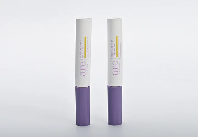 White cosmetic tube with purple printed decoration