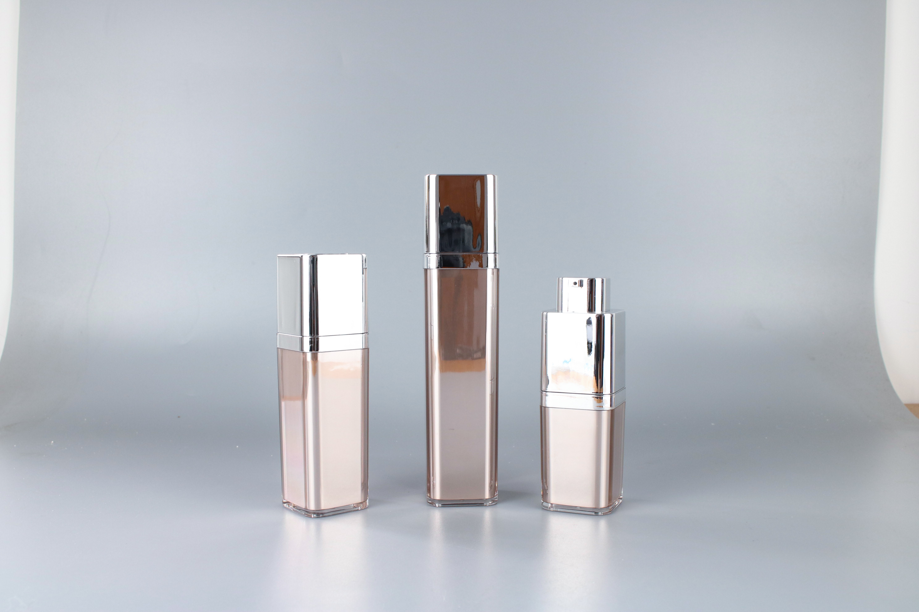 Three Oulete rectangular pump bottles with silver-tone closures
